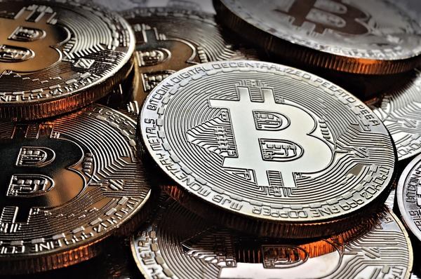 Pile of silver and gold Bitcoin coins close-up