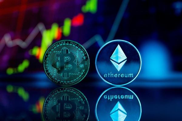 Bitcoin and Ethereum coins glowing under neon chart lights